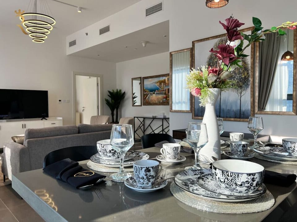 Indulge in culinary delights at our elegant dining table, where the ambiance is as inviting as the cuisine.