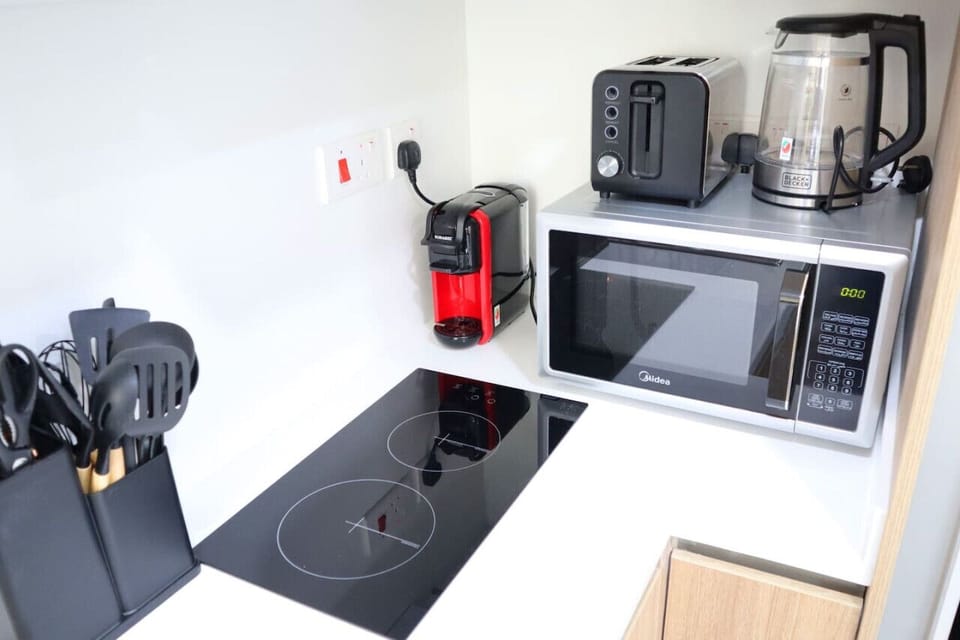 Experience the perfect blend of high-end design and practical appliances in this modern kitchen.