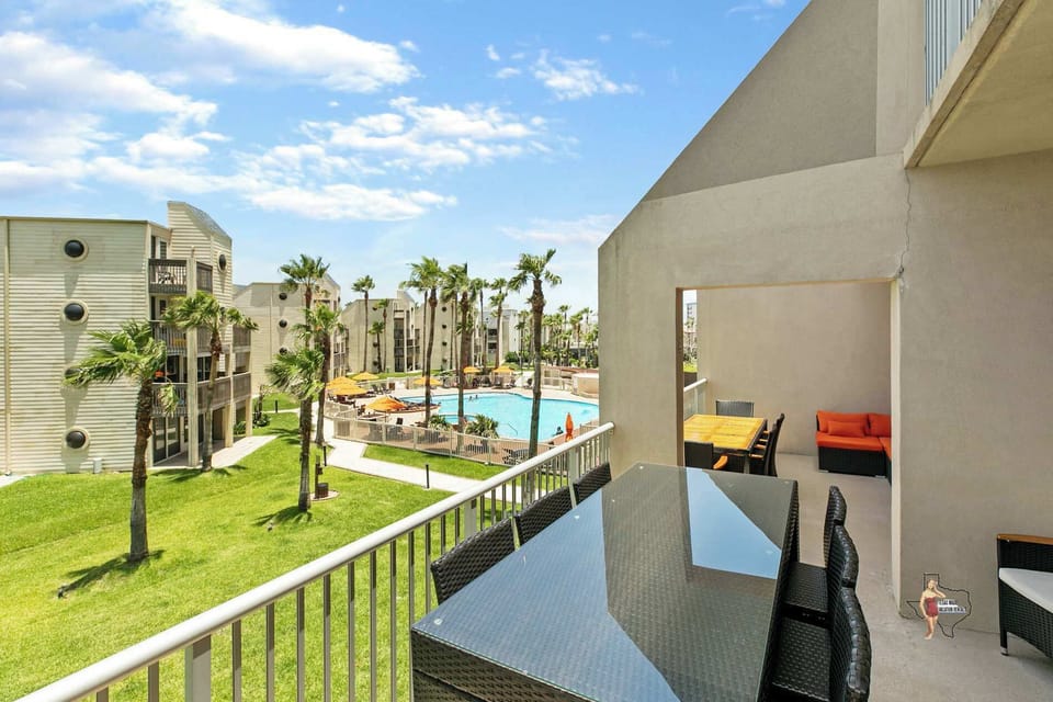 Your private balcony features tables for dining and cushioned seating