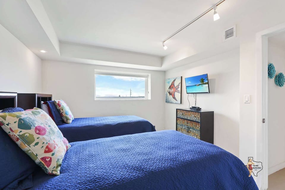There's a wall-mounted TV, lots of natural light and room-darkening shades