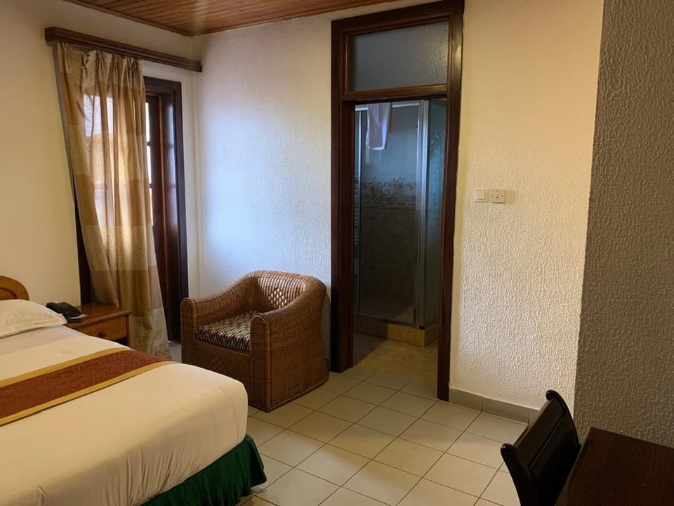 Standard Single Room, City View | In-room safe, desk, laptop workspace, iron/ironing board