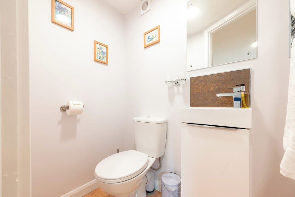 Ensuite bathroom in main bedroom with heated towel rail.