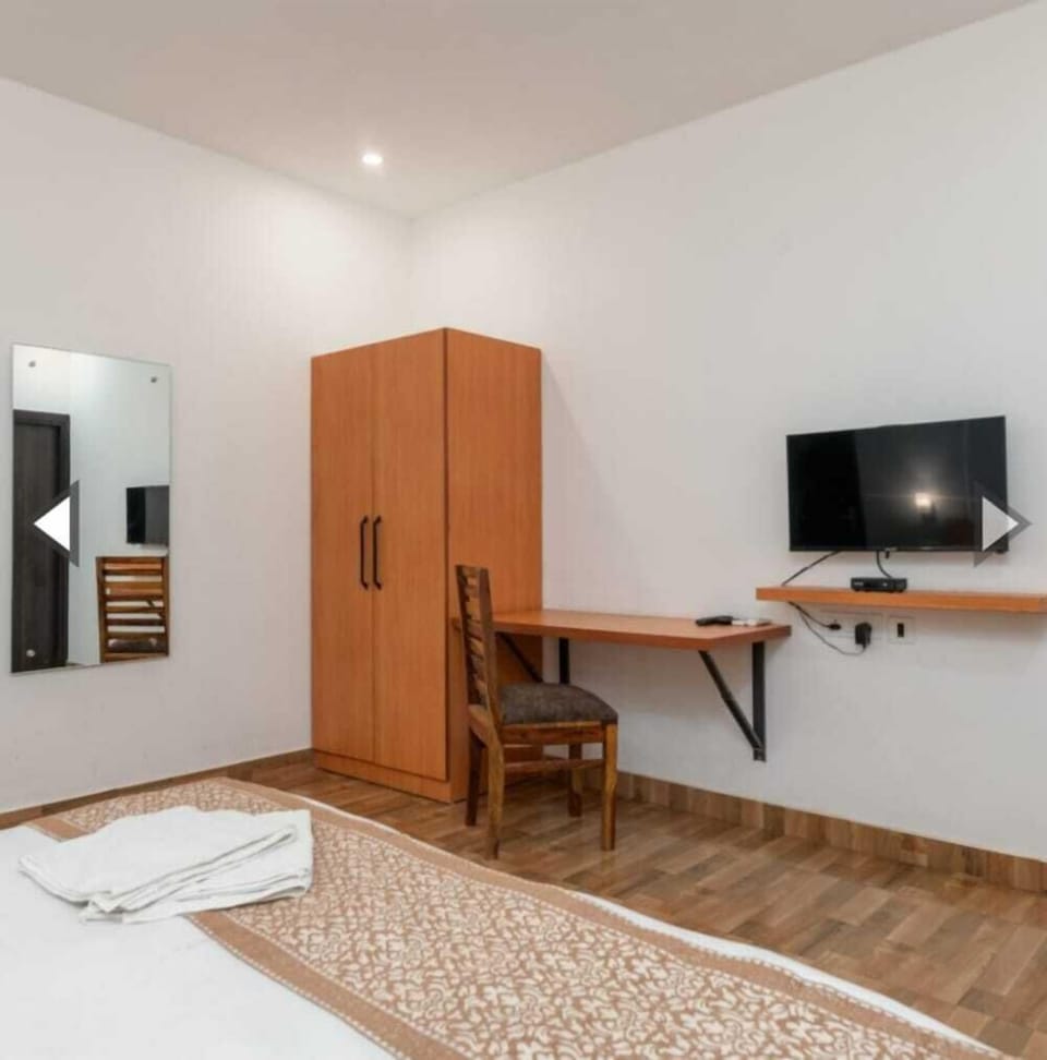 Premium Room | Desk, laptop workspace, blackout drapes, iron/ironing board