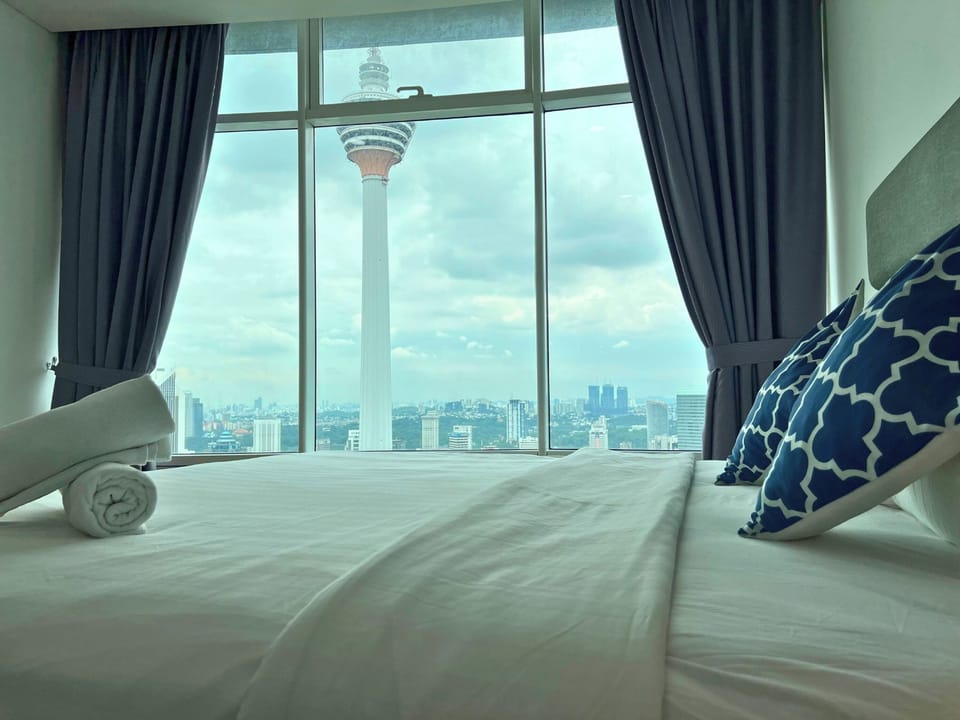 Two Bedrooms Apartment | Desk, blackout drapes, iron/ironing board, free rollaway beds