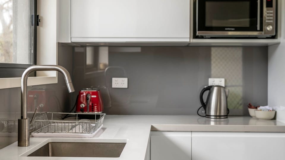 Clean and contemporary cooking space.