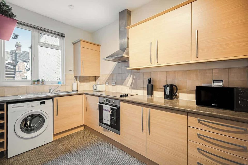 Packed with all the essentials for a hassle-free stay, the kitchen even includes a washing machine for your convenience