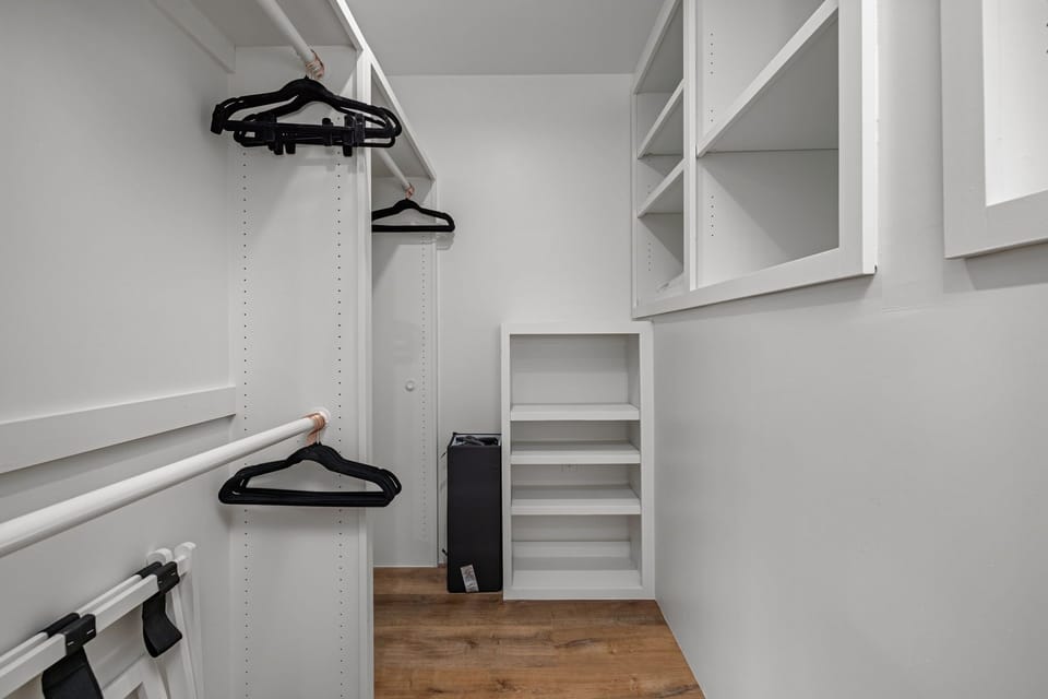 Primary closet with a pack n play
