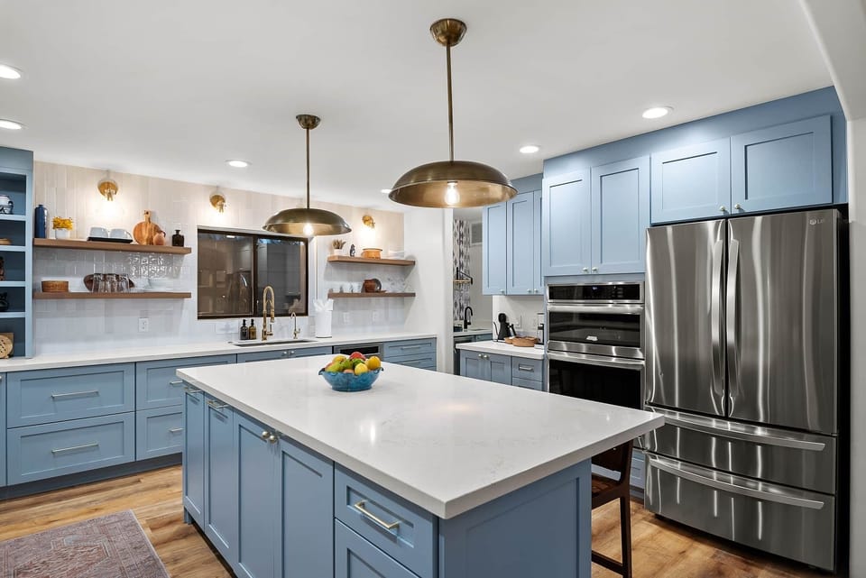 Kitchen fully equipped featuring microwave and 2 ovens