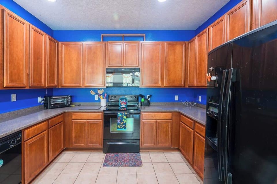 Cook up your favorites in this fully equipped kitchen, complete with modern appliances and vibrant Disney accents.