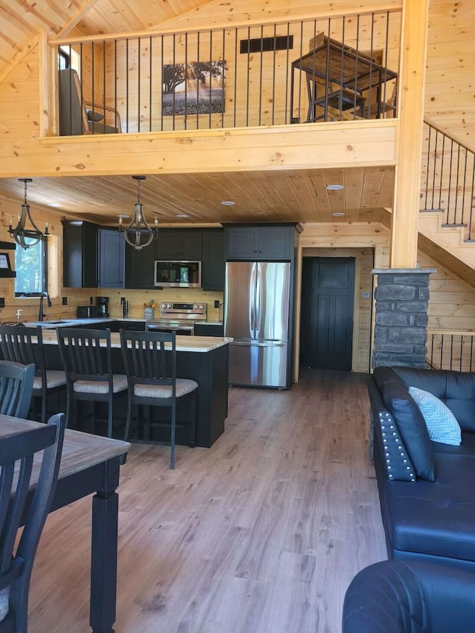 The stylish kitchen offers a warm, open space perfect for cooking, gathering, and relaxing.