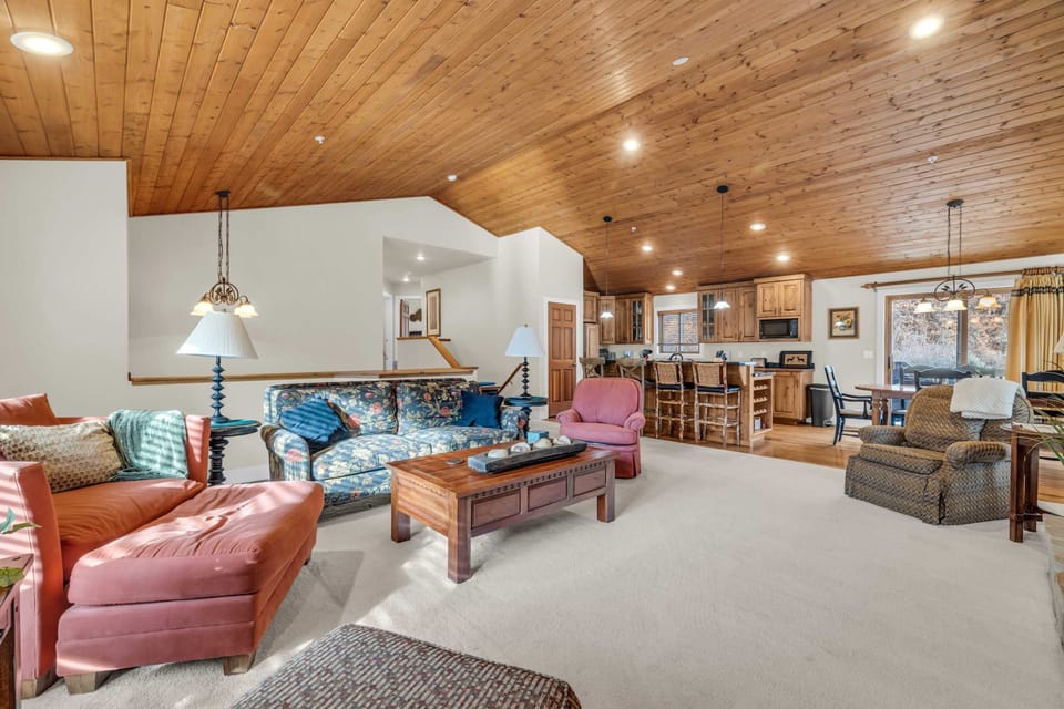 Living Room: Couch, 3 chairs, wood burning fireplace, 40” TV w/cable

