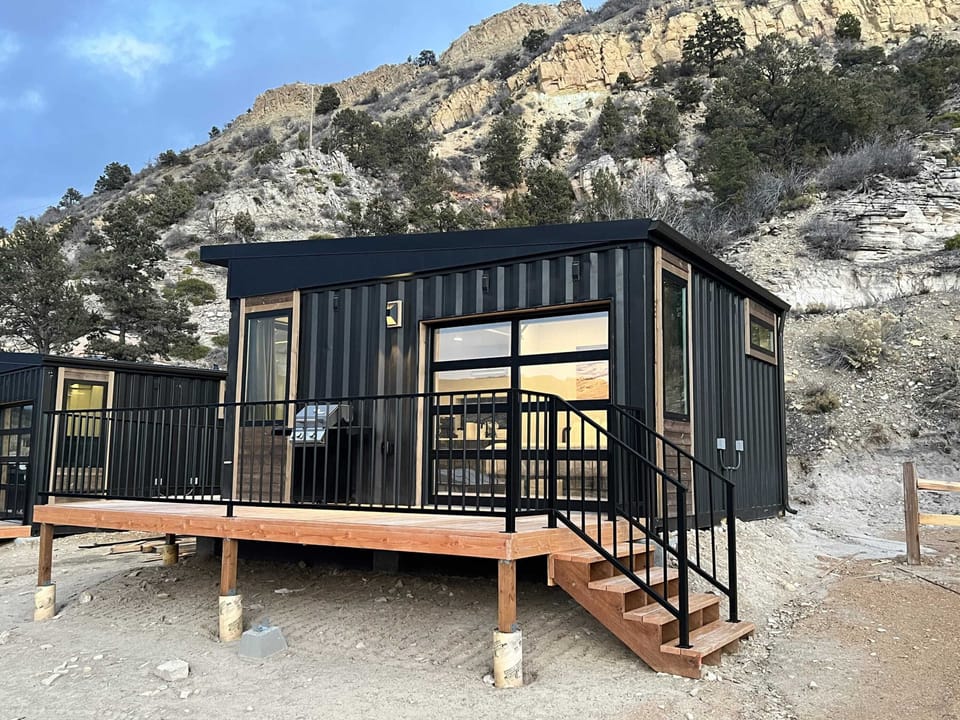 Private outdoor deck with a gas fire pit and seating, perfect for cozy evenings at your modern cabin near Zion National Park and Bryce Canyon.
