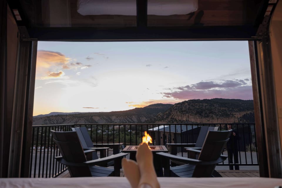 Private outdoor deck with a gas fire pit and seating, perfect for cozy evenings at your modern cabin near Zion National Park and Bryce Canyon.