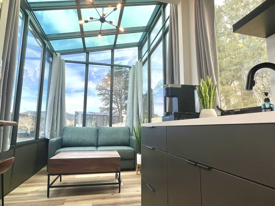 Red Hollow living area with scenic window views, creating a peaceful place to recharge after exploring Southern Utah.