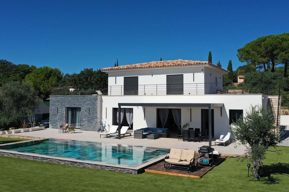Stunning aerial view of Villa Belletoile, showcasing its infinity pool and luxurious setting in the heart of Provence.