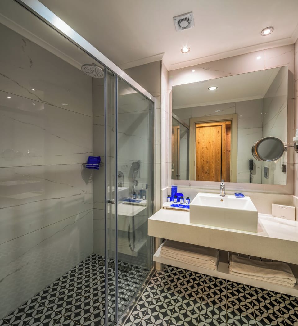 Shower, hair dryer, slippers, towels