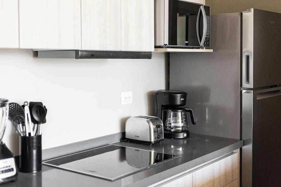 Sleek, modern kitchen with all essentials for cooking during your stay.