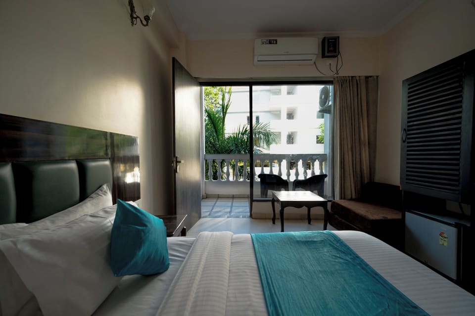 Deluxe Double Room, Pool View | Balcony view