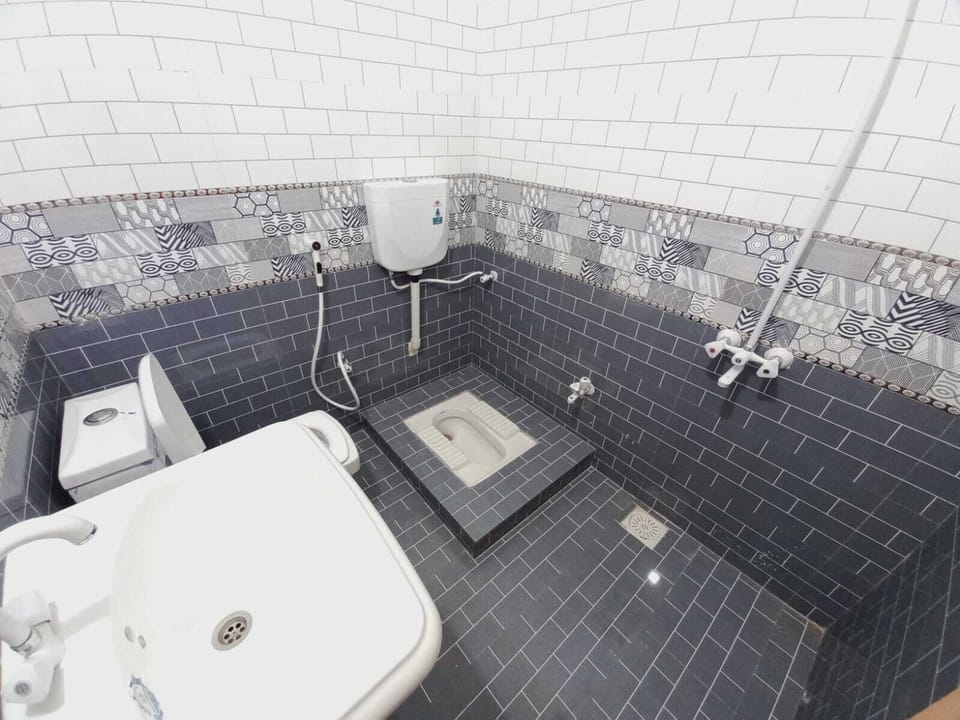 Bathtub, slippers, towels, soap