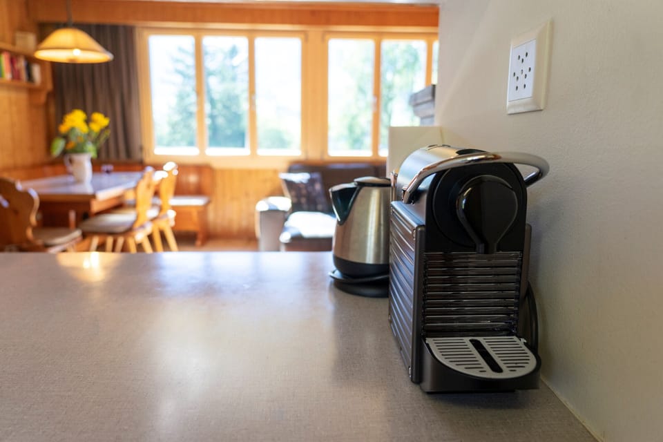 Coffee machine in the kitchen overlooking the living room