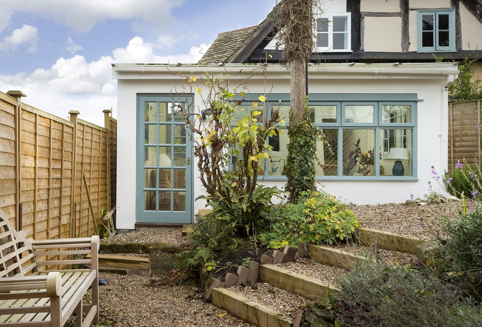 The garden room opens onto an attractive pebbled garden