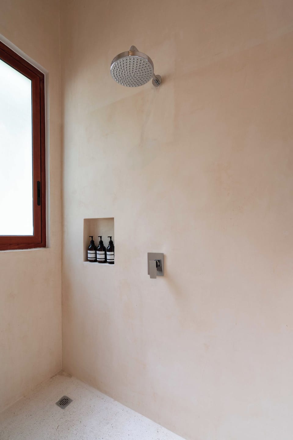 Bathroom with a sleek look, featuring essential amenities.
