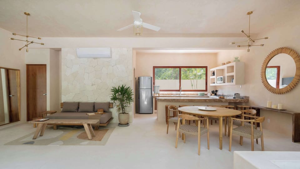 Combined dining and lounging space with chic design and natural light.