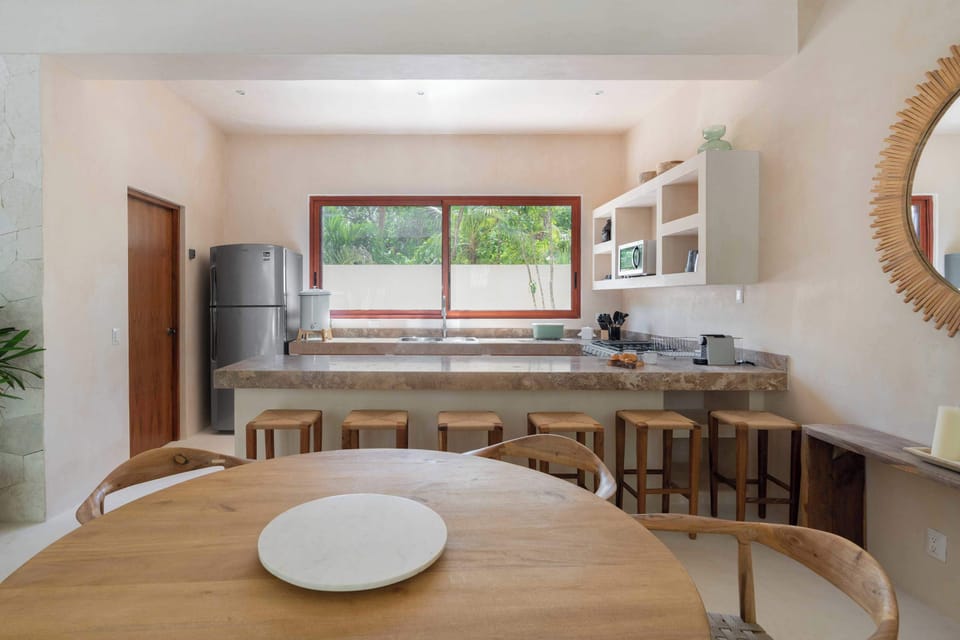 Spacious kitchen with bar seating, blending functionality and style.