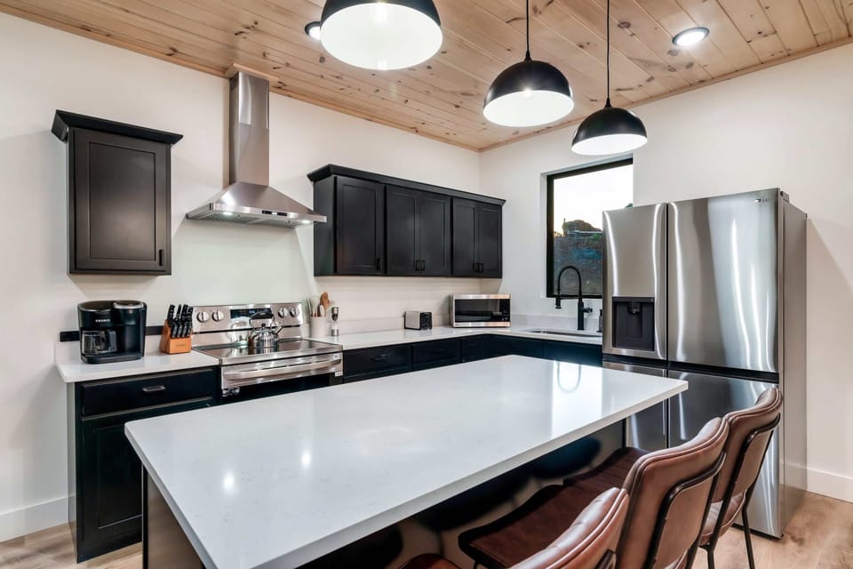 Whip up culinary delights in this sleek, modern space with stunning mountain views!