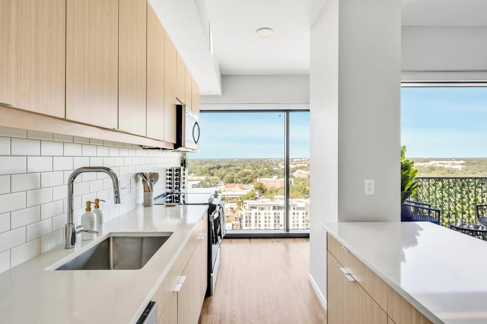 Kitchen with cooking essentials including microwave, oven, ice machine, dishwasher