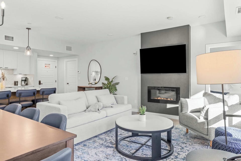Living area with smart tv with cable and electric fireplace
