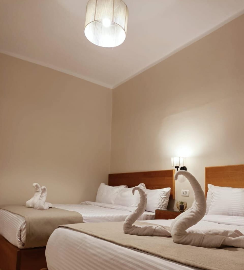 Luxury Quadruple Room, 2 Queen Beds, Non Smoking, Private Bathroom | Minibar, desk, soundproofing, iron/ironing board