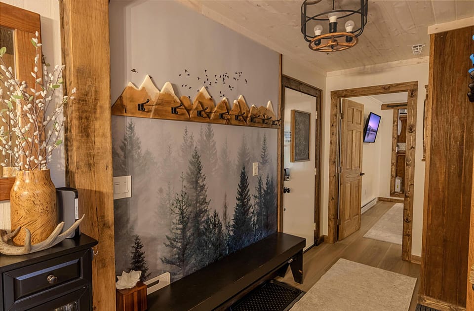 Hang your jackets in the foyer area and store your ski and snowboard equipment in the gravity wall rack (not shown.)