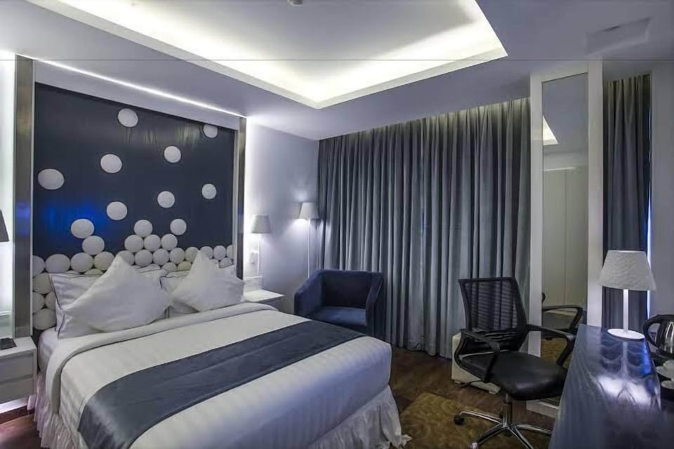 Deluxe Twin Room, City View | In-room safe, desk, laptop workspace, blackout drapes