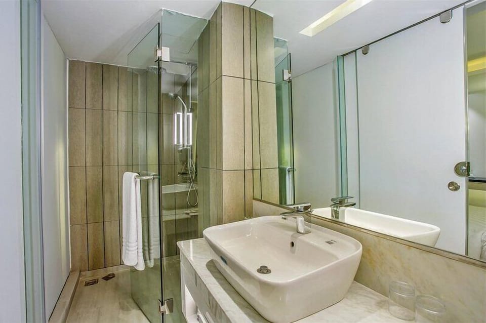 Shower, hair dryer, slippers, towels