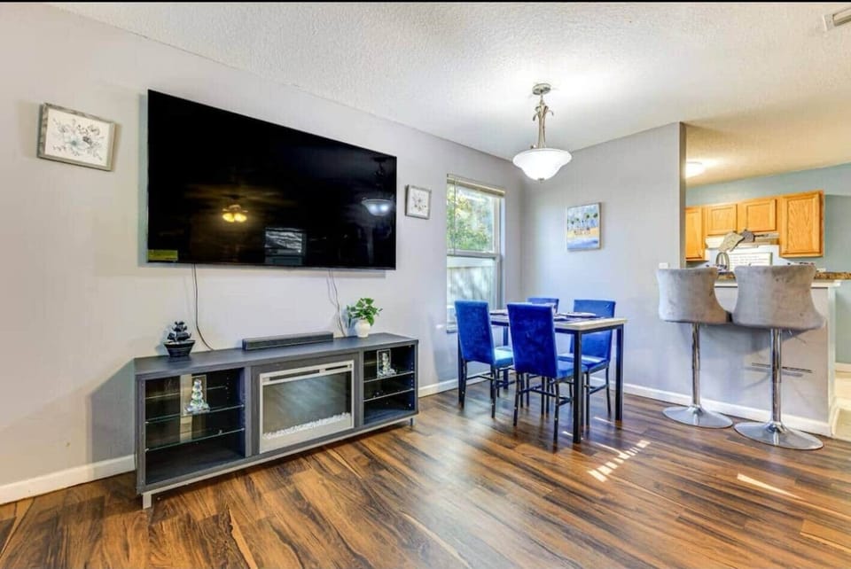 Share stories and laughter around the dining table, perfect for family meals or game nights. The comfortable chairs and cheerful ambiance make this a favorite spot to gather.