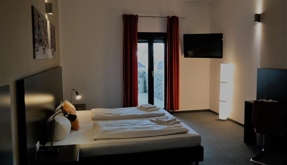 Premium bedding, desk, laptop workspace, soundproofing