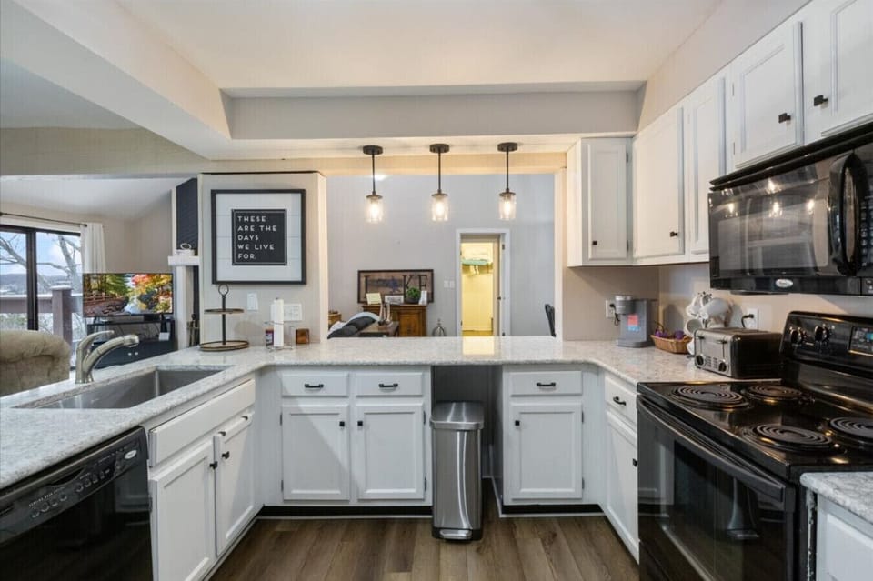 Large kitchen with plenty of countertop space, ample cabinetry, and new stainless steel appliances