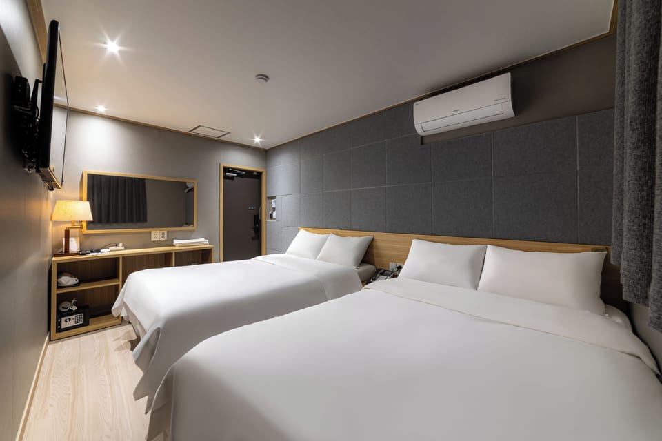 Family Twin Room | In-room safe, desk, blackout drapes, iron/ironing board (on request)