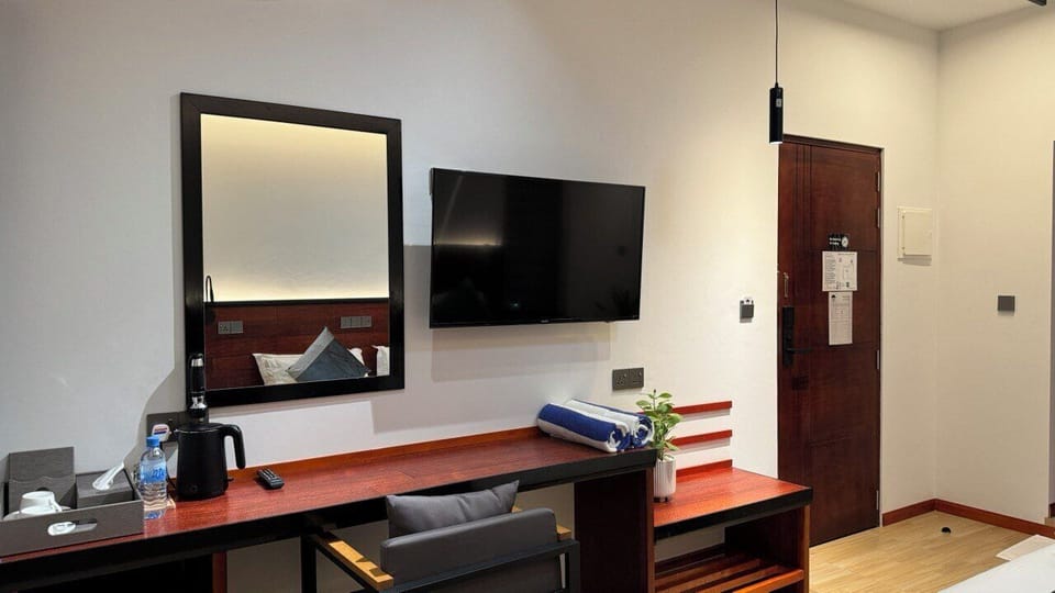 Superior Room, Beach View | In-room safe, desk, laptop workspace, iron/ironing board