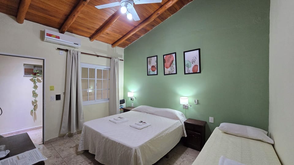 Family Triple Room | Minibar, in-room safe, individually furnished, free WiFi
