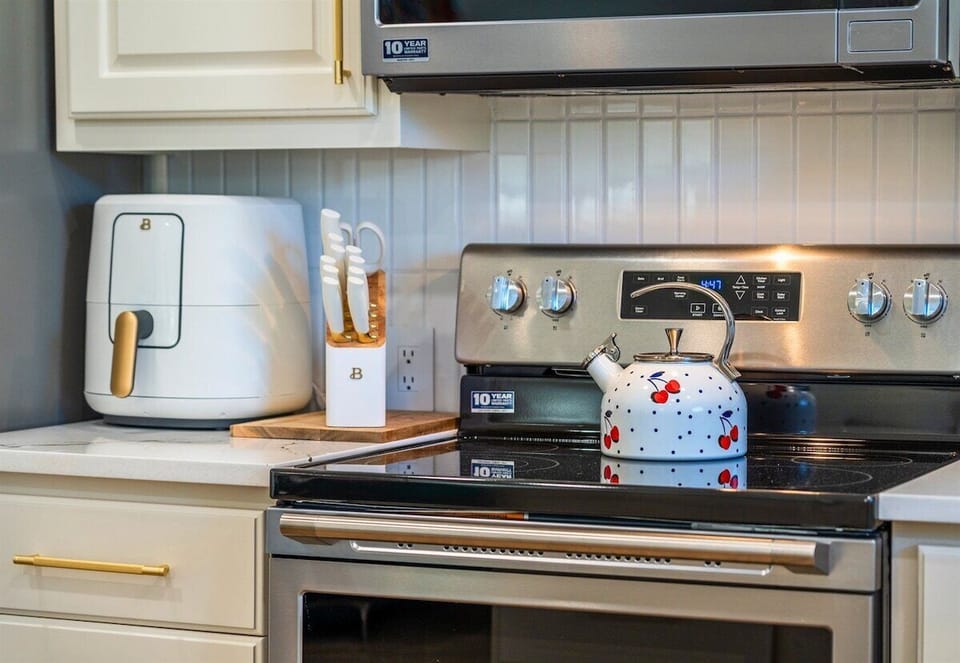 A peek at the kitchen's coffee station, fully stocked for your morning brew. Whether you're an espresso lover or prefer a classic drip coffee, this setup has you covered.