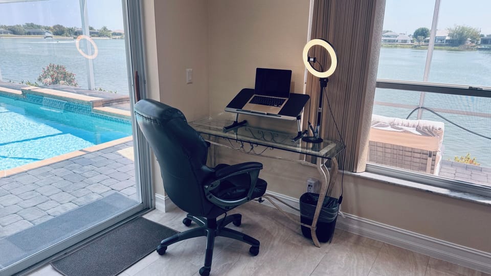 Dedicated work space with office chair and ring light