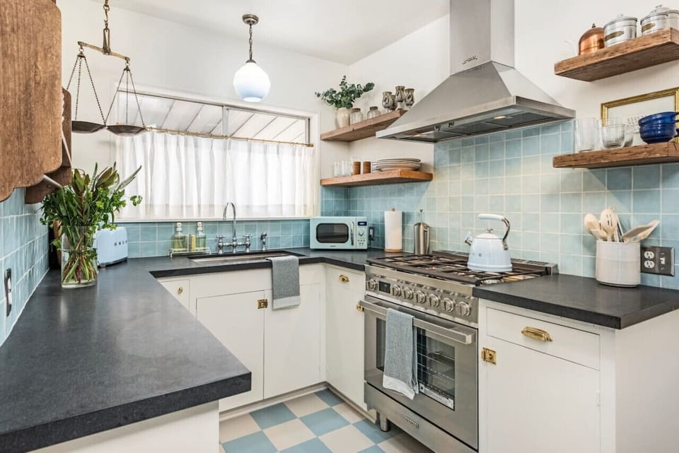 Chef-ready kitchen featuring iconic SMEG appliances and stunning vintage tile.