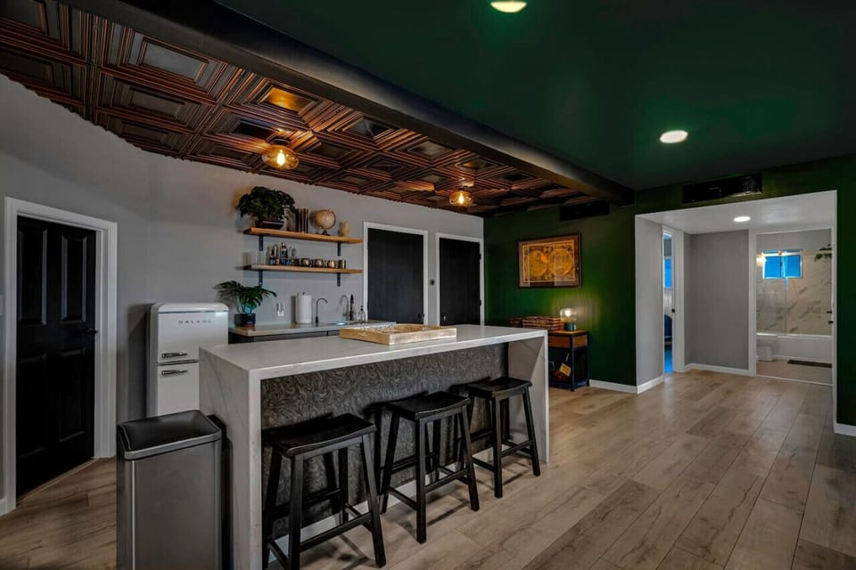 The Private Speakeasy: an adults-only retreat with a cocktail bar, rich finishes, and moody ambiance designed for connection and relaxation.