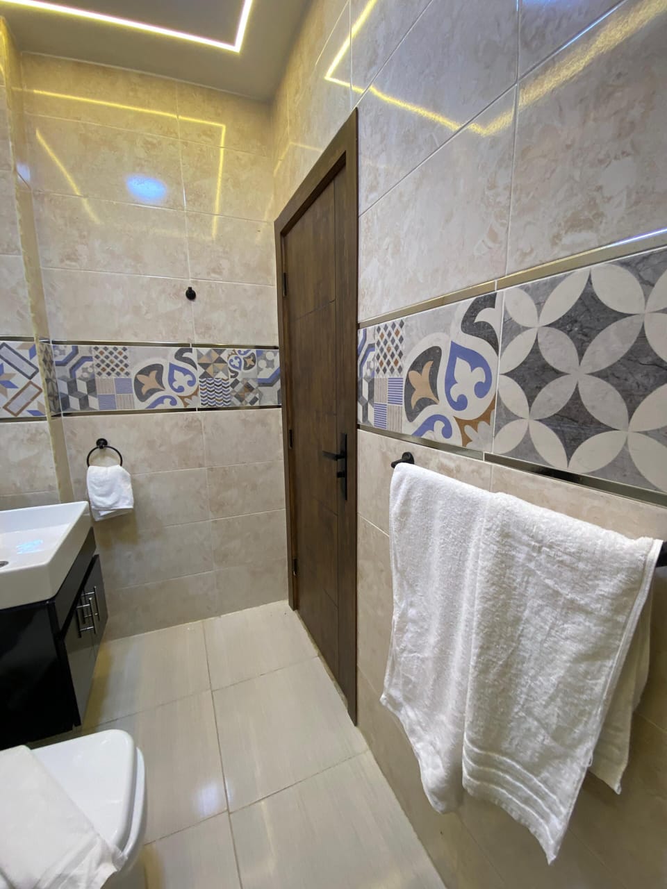 Shower, rainfall showerhead, designer toiletries, hair dryer