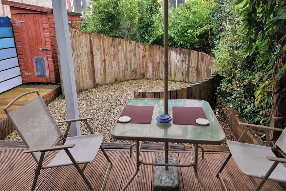 Rear exterior with decking,tables and chairs
