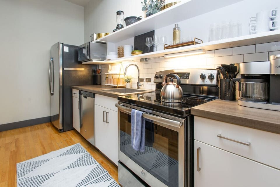 Kitchen: Modern appliances meet stylish design, perfect for culinary adventures in Knoxville!