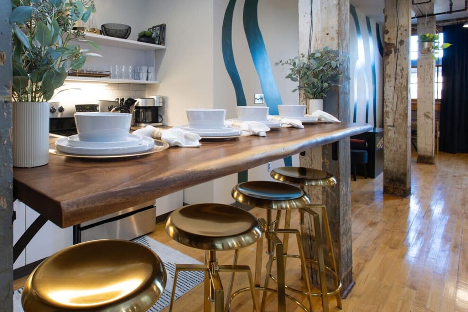 Dining Area: Stylish wooden bar with golden stools—perfect for meals and great conversations!