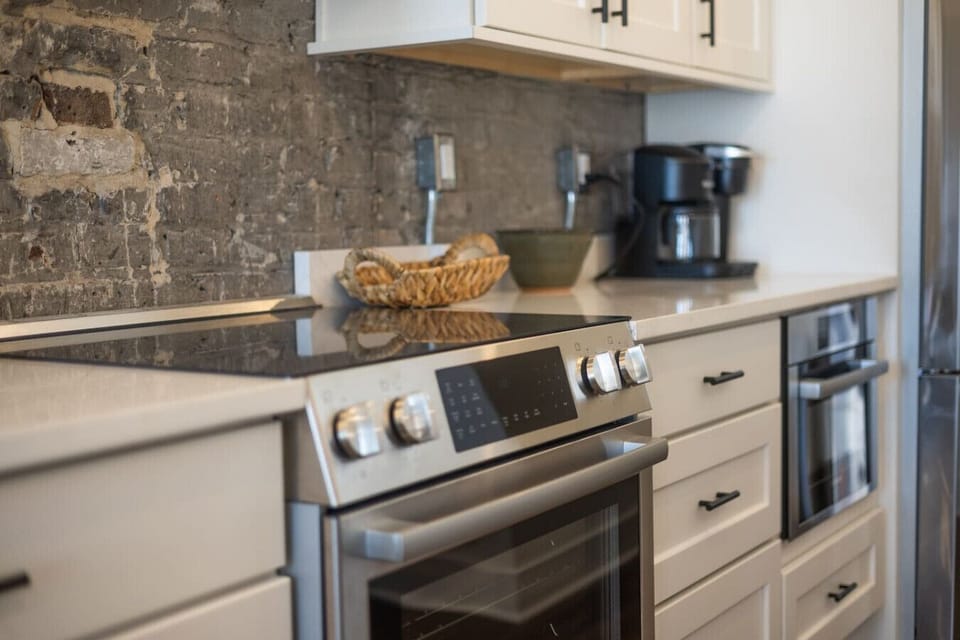 Kitchen: Sleek appliances and rustic charm await your culinary adventures in Knoxville!